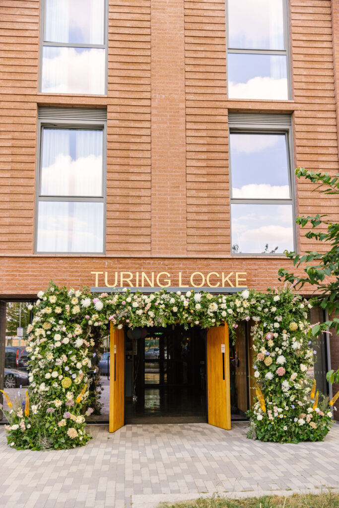 Bespoke floral and foliage entrance arch created to celebrate the Launch of hotel, Turing Locke.